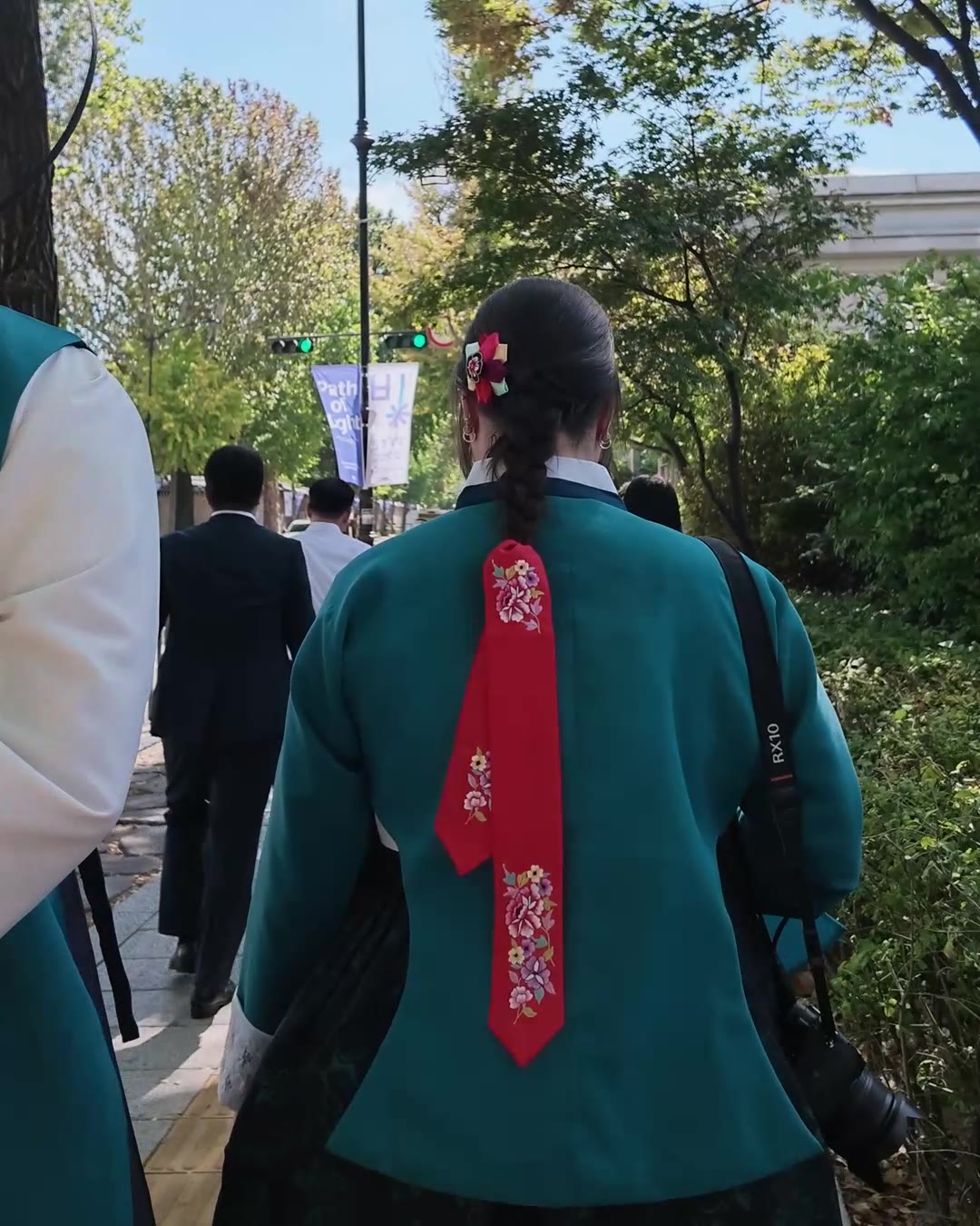 Hanbok with red daenggi ribbon, seen from behind